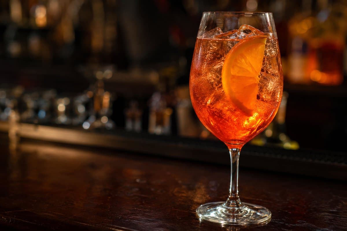 Aperol Spritz cocktail - aperitif-based served in a glass with garnish