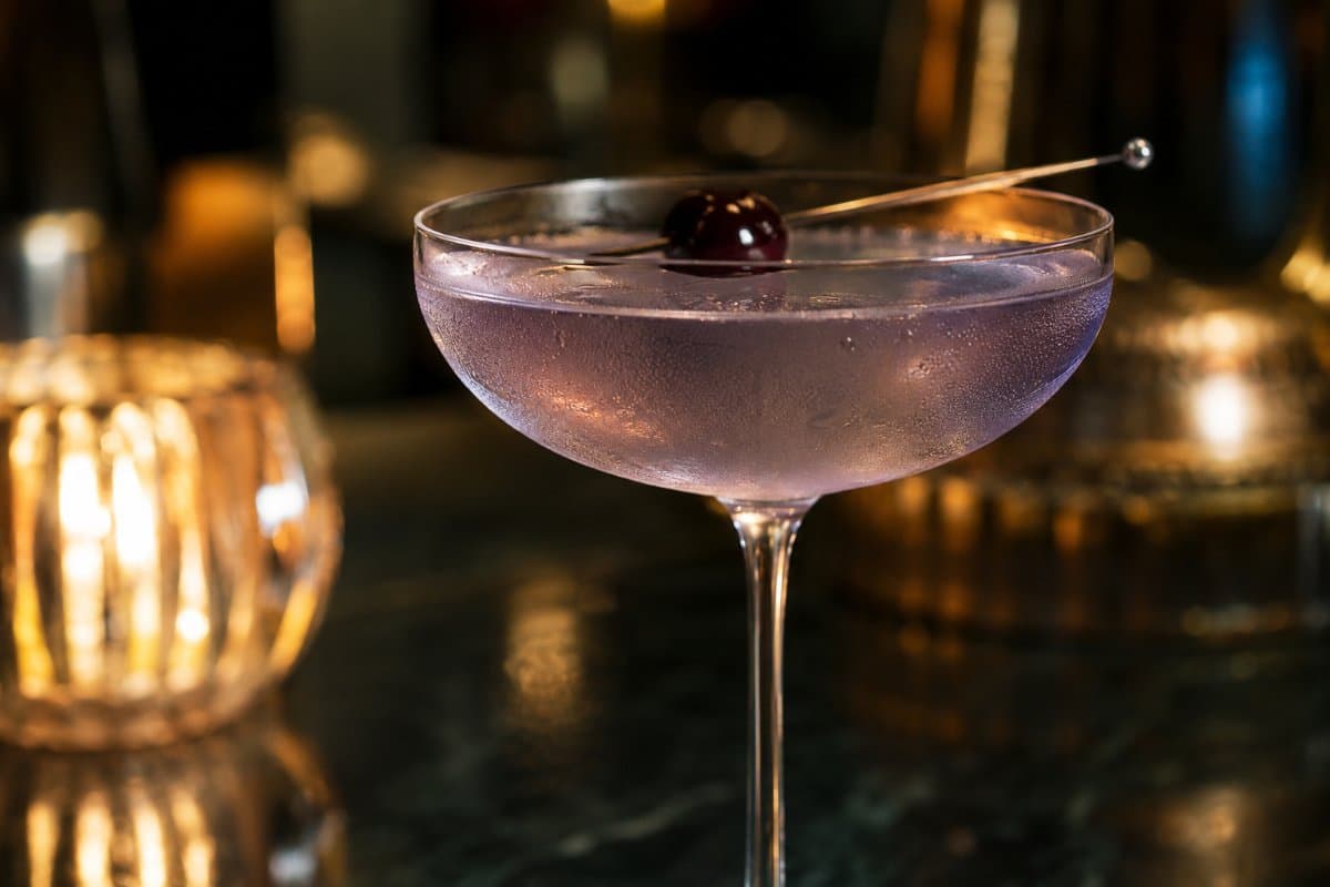 Aviation cocktail - gin-based served in a glass with garnish