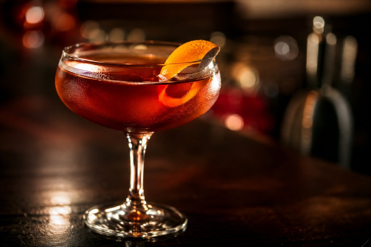Boulevardier cocktail - whiskey-based served in a glass with garnish