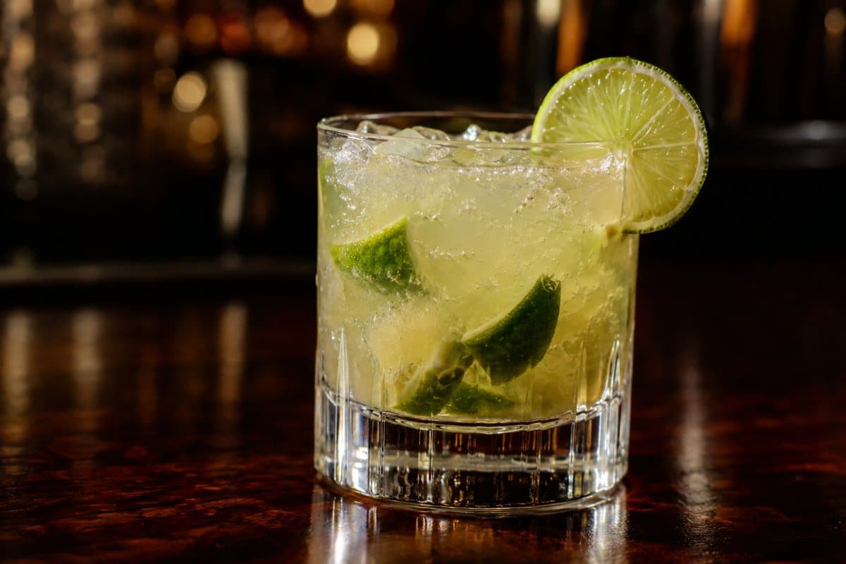 Caipirinha cocktail - cachaça-based served in a glass with garnish