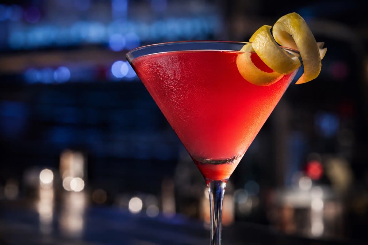 Cosmopolitan cocktail - vodka-based served in a glass with garnish