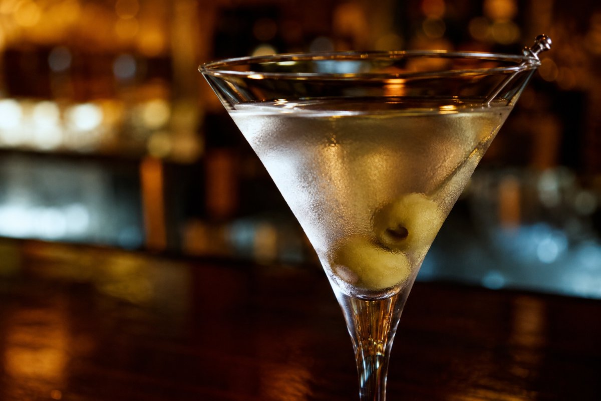 Dirty Martini cocktail - gin-based served in a glass with garnish