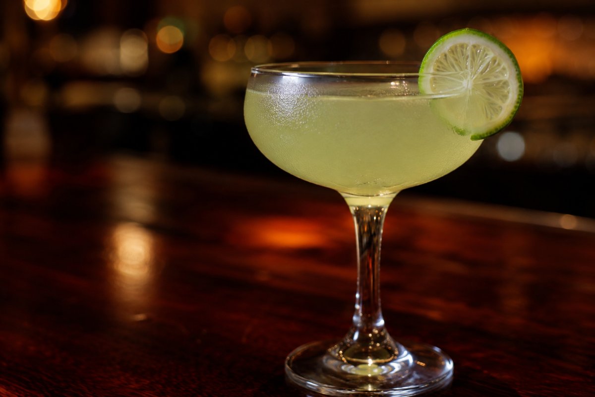 Gimlet cocktail - gin-based served in a glass with garnish