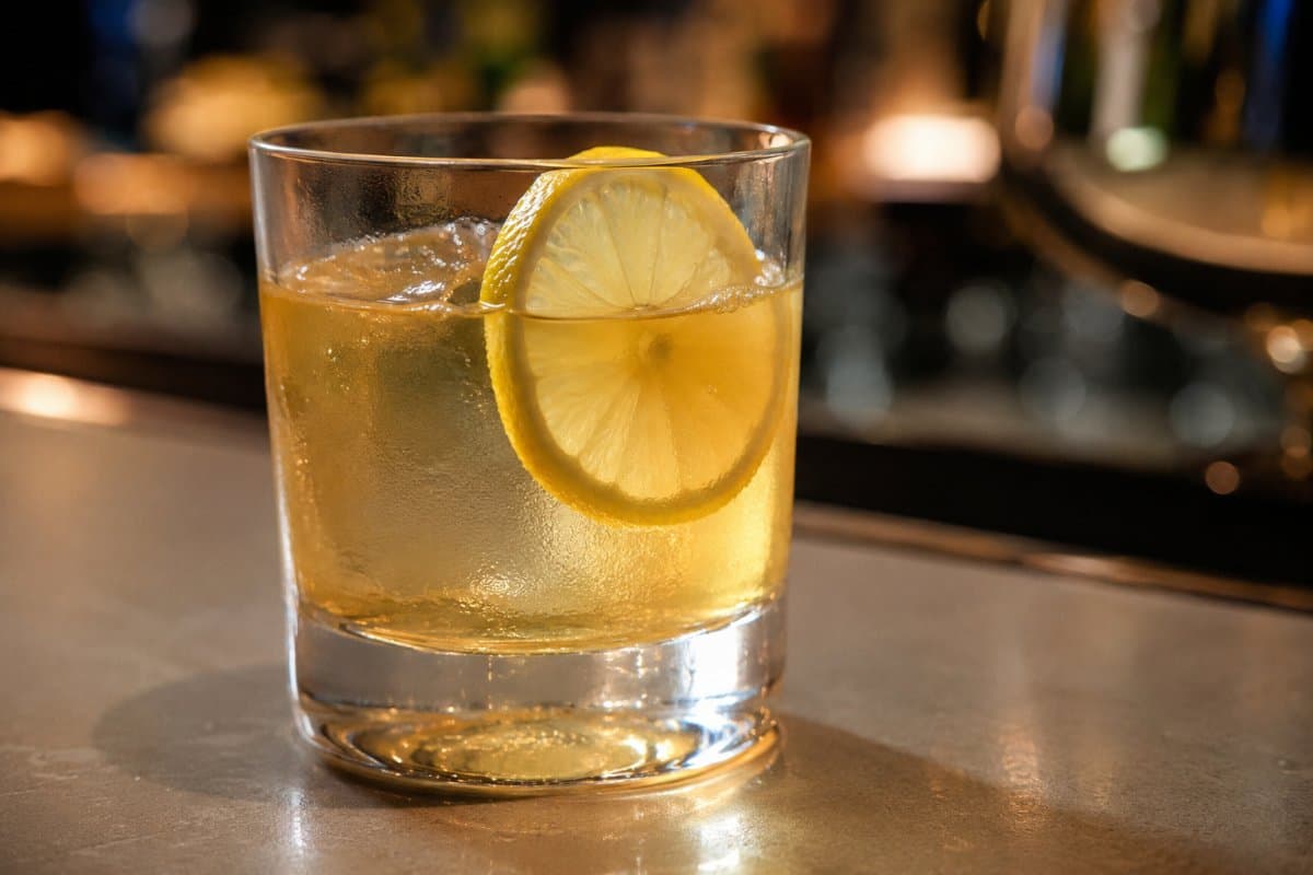 Gold Rush cocktail - whiskey-based served in a glass with garnish