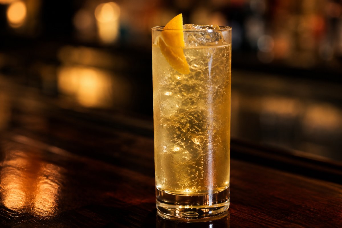 John Collins cocktail - bourbon-based served in a glass with garnish