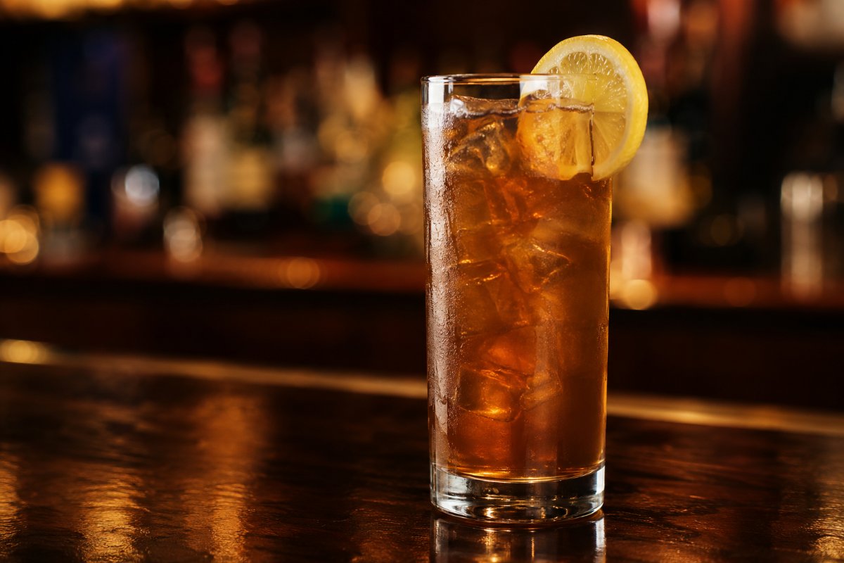 Long Island Iced Tea cocktail - vodka-based served in a glass with garnish