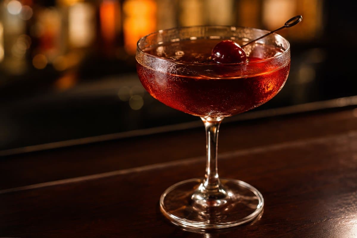 Manhattan cocktail - whiskey-based served in a glass with garnish