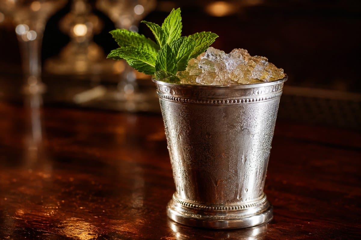 Mint Julep cocktail - whiskey-based served in a glass with garnish