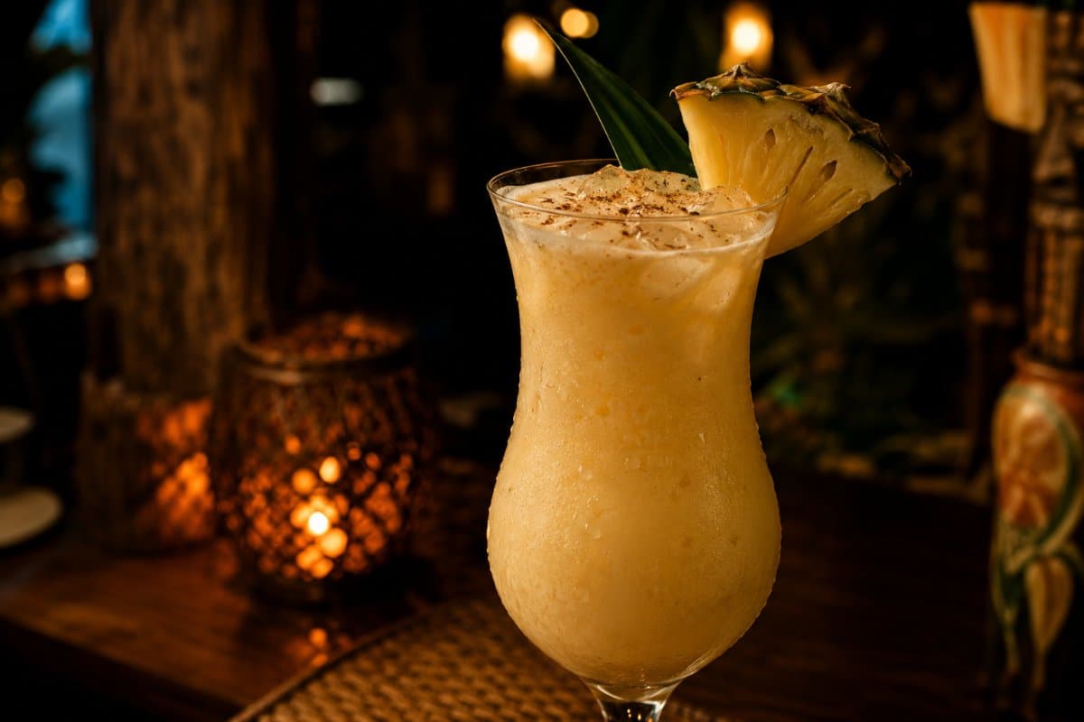 Painkiller cocktail - rum-based served in a glass with garnish