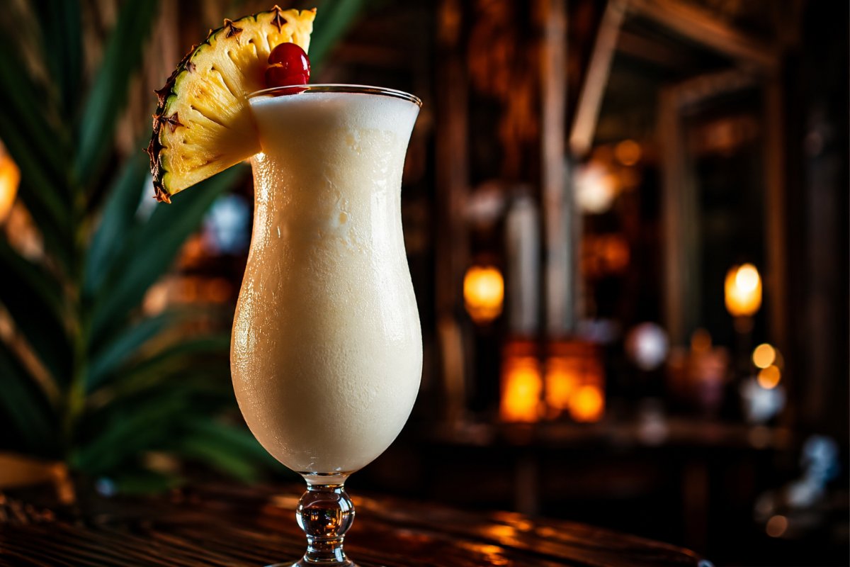 Piña Colada cocktail - rum-based served in a glass with garnish