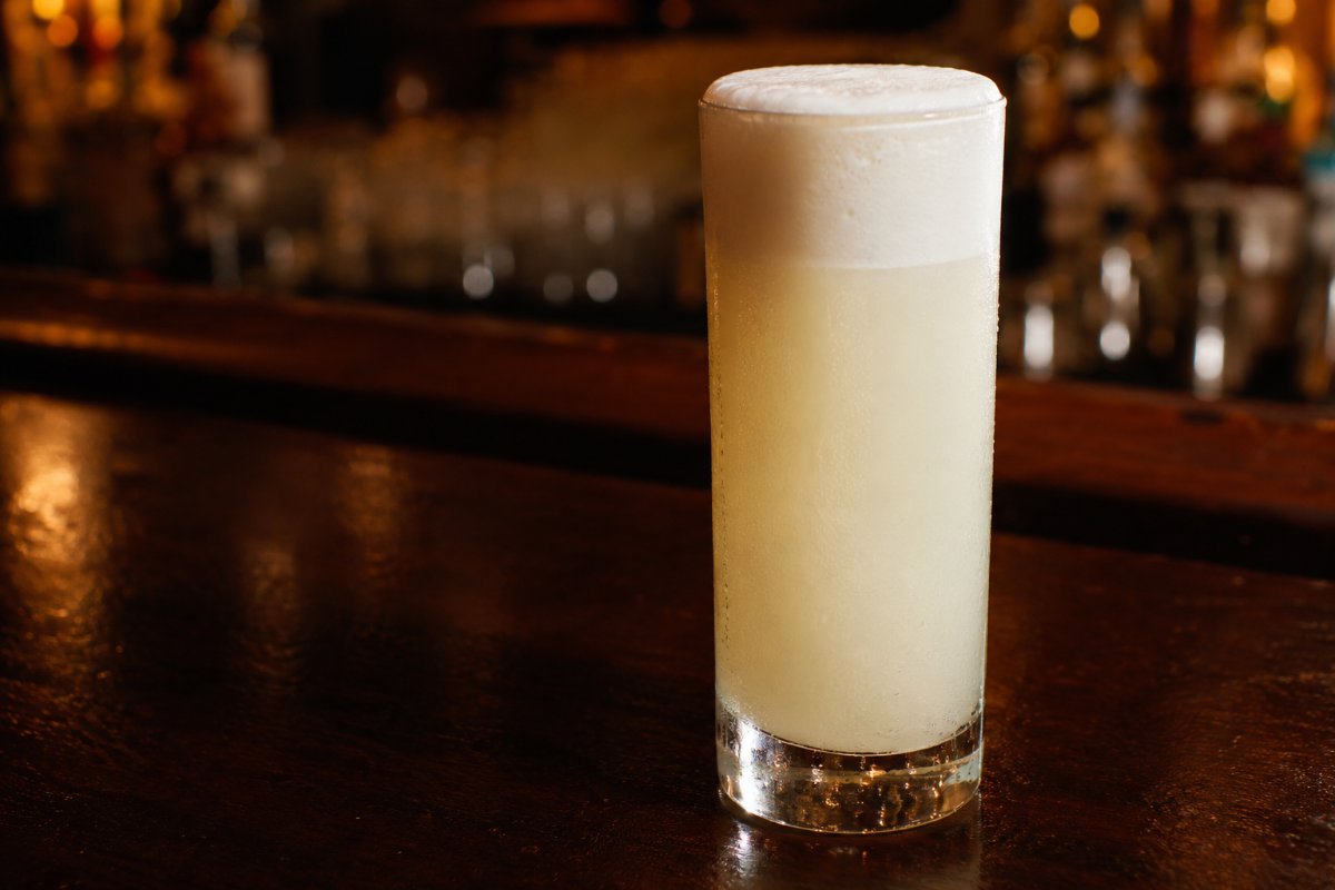 Ramos Gin Fizz cocktail - gin-based served in a glass with garnish