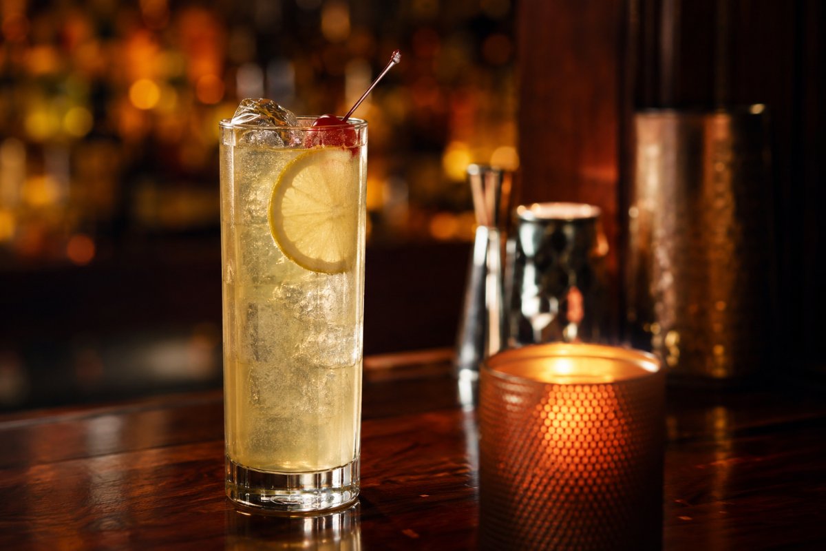 Tom Collins cocktail - gin-based served in a glass with garnish
