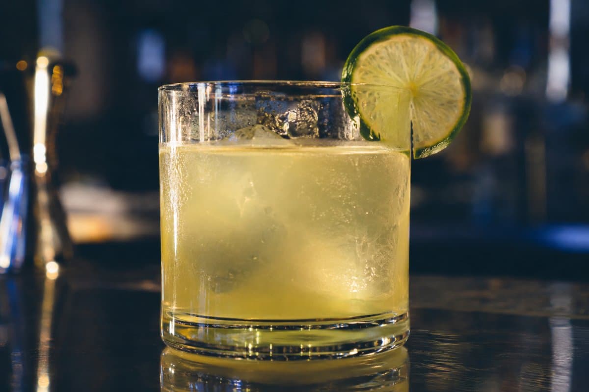 Tommy's Margarita cocktail - tequila-based served in a glass with garnish