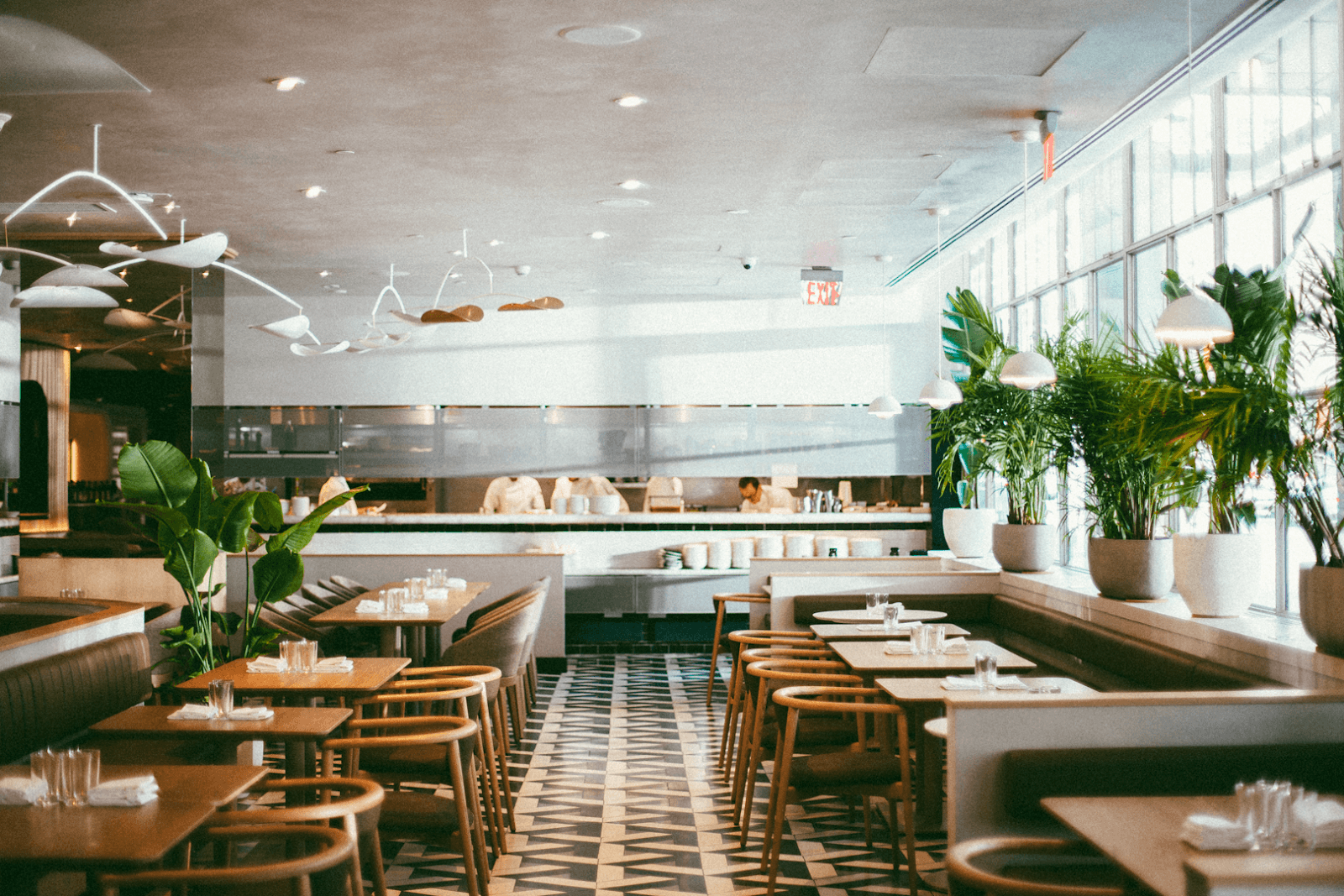 Bright restaurant interior with modern decor and large windows