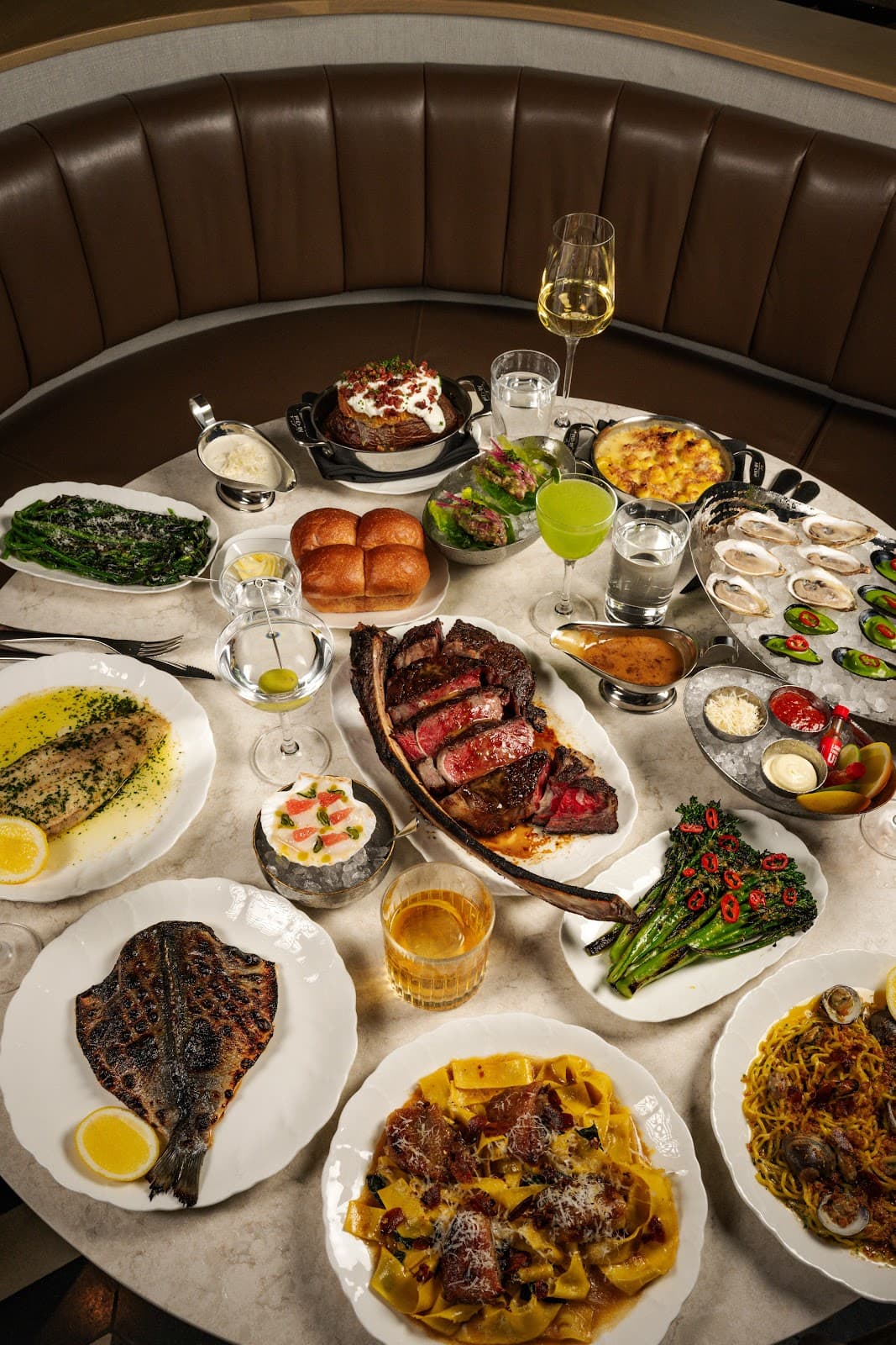 Elegant table setting with diverse gourmet dishes and cocktails in Toronto