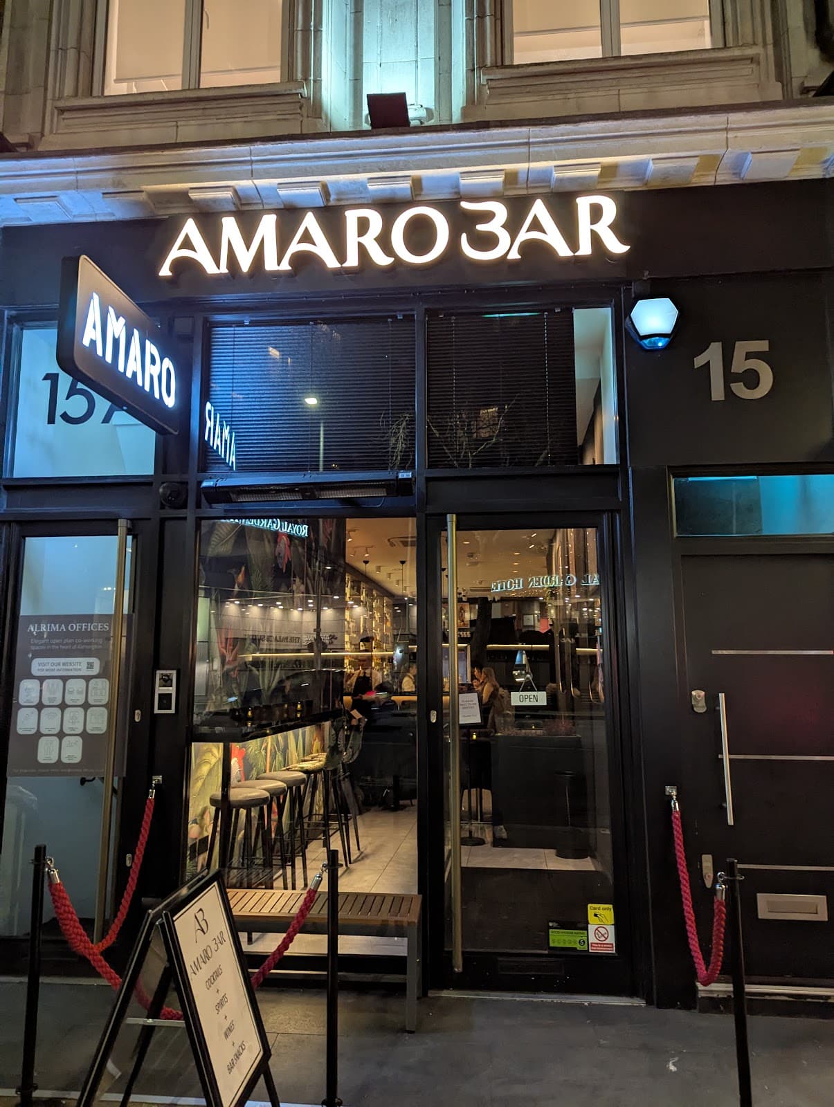 Exterior view of Amaro Bar with illuminated sign and entrance in London