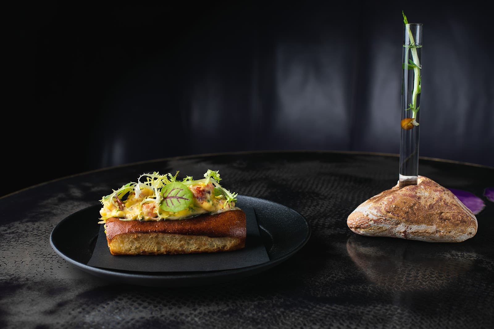 Elegant dish with garnish and artistic presentation on dark table in London