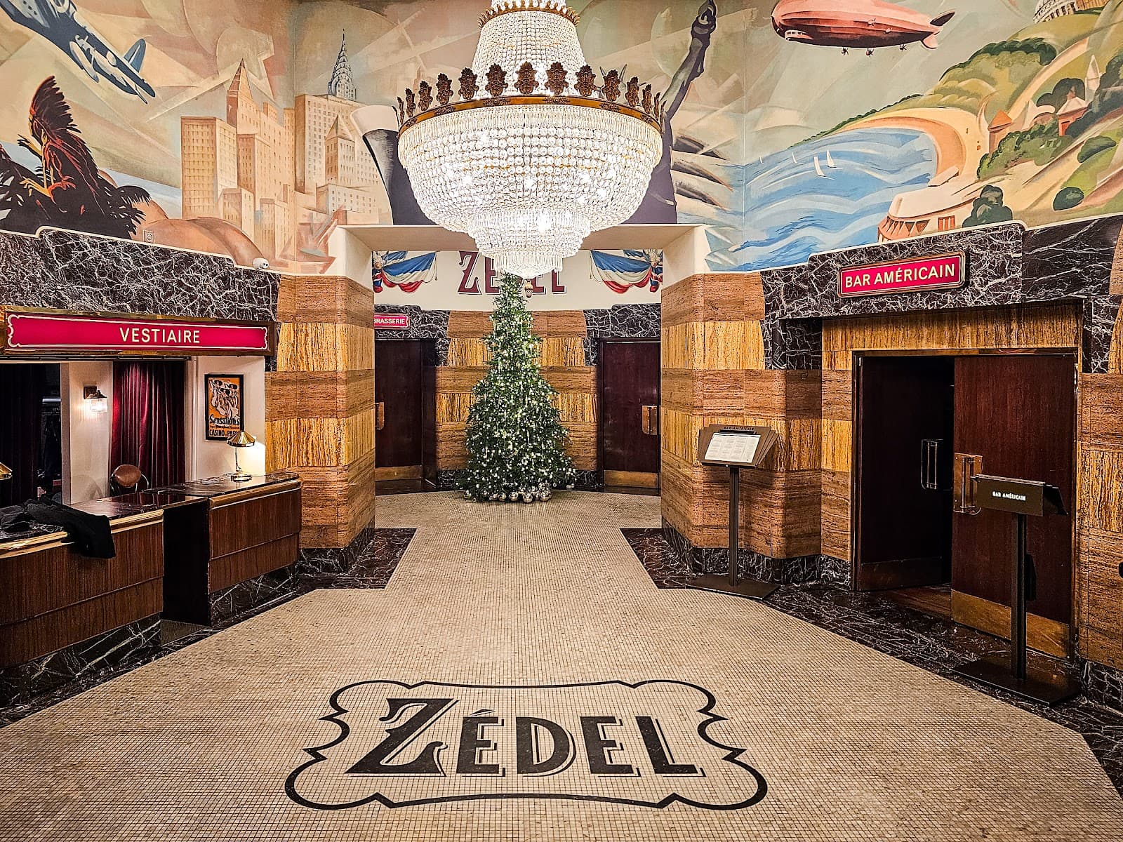 Art deco interior with chandelier and Zedel logo on the floor in London
