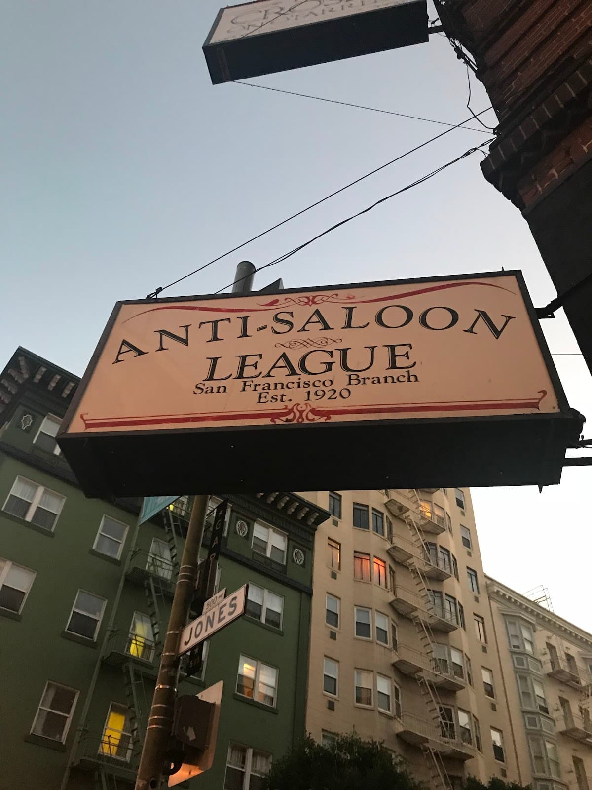 Exterior view of Anti-Saloon League sign at dusk with building background in San Francisco