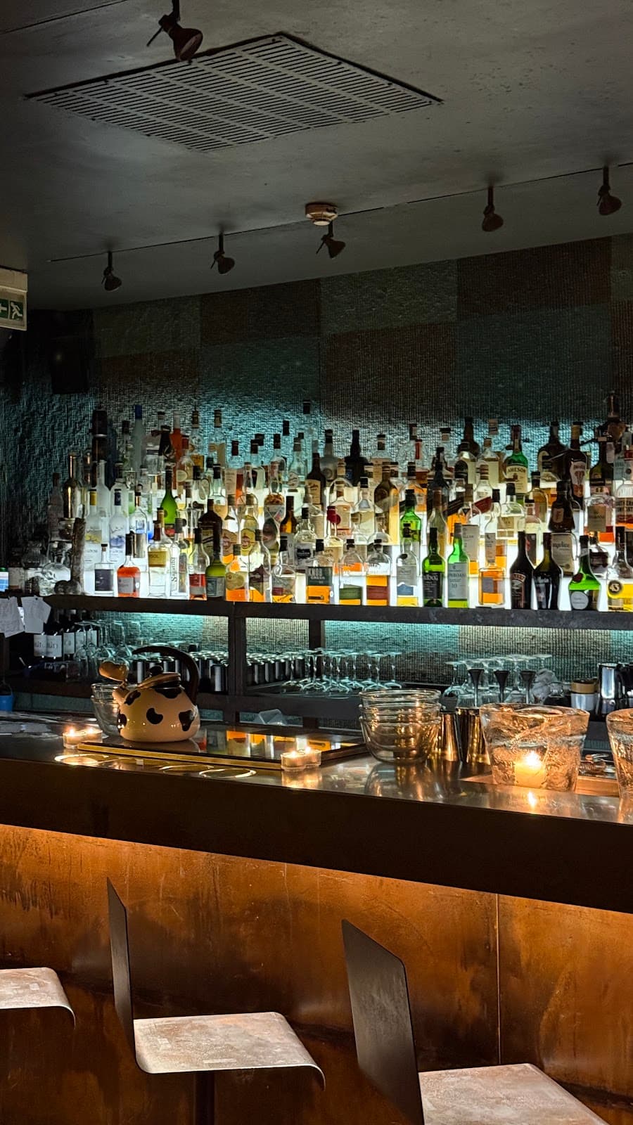 CINCO Lounge bar area with cocktails and spirits selection