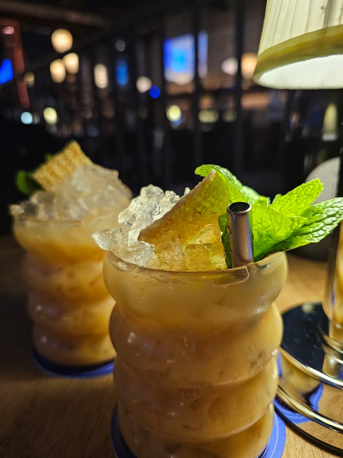 Close-up of two cocktails with mint garnish and textured glasses in Toronto