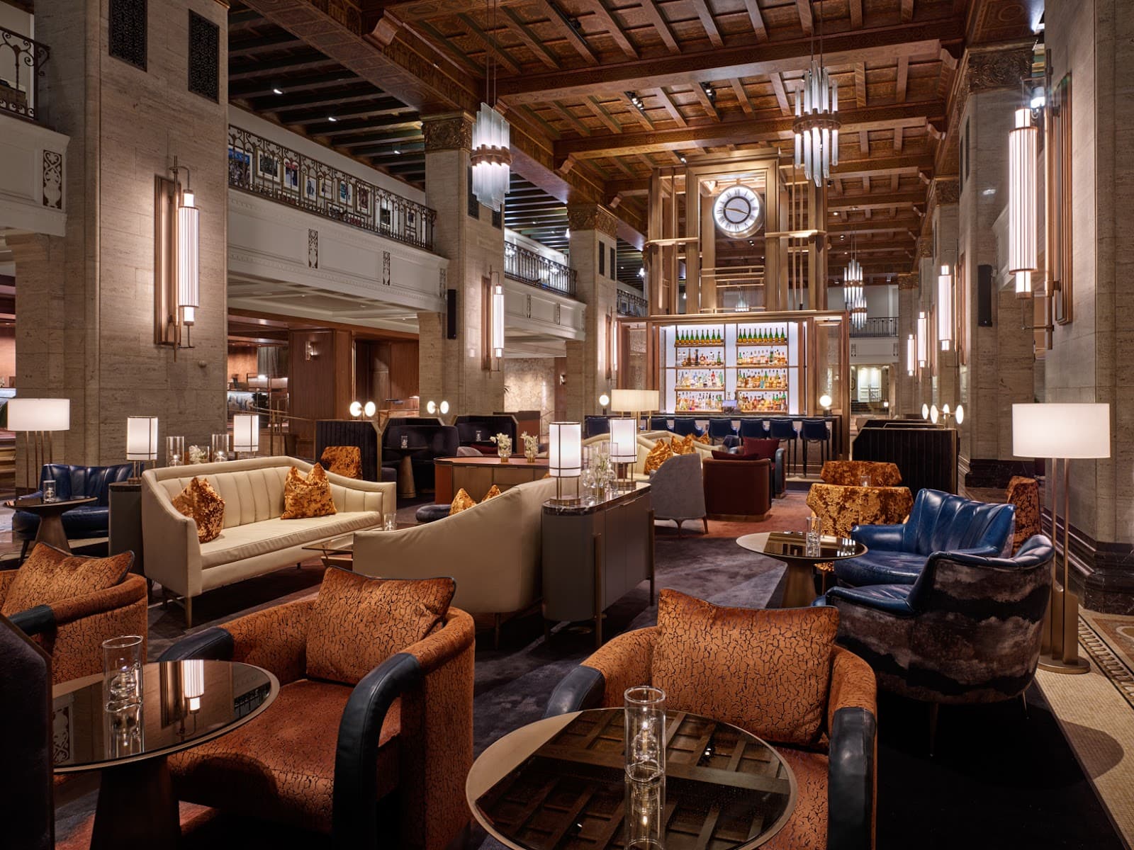 Elegant interior featuring luxurious seating and a backlit bar area