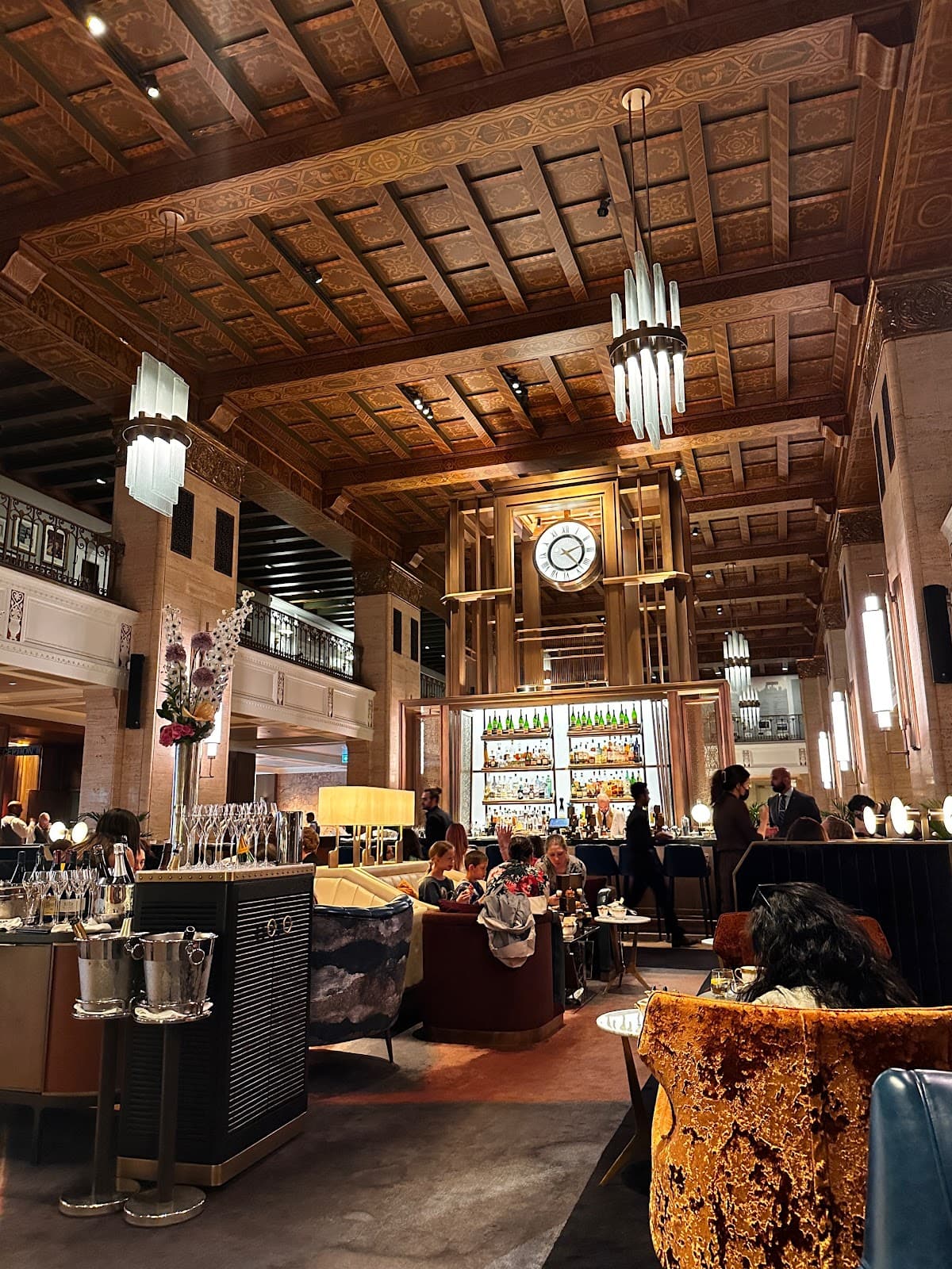 Luxurious bar interior with ornate ceiling and a large clock in Toronto