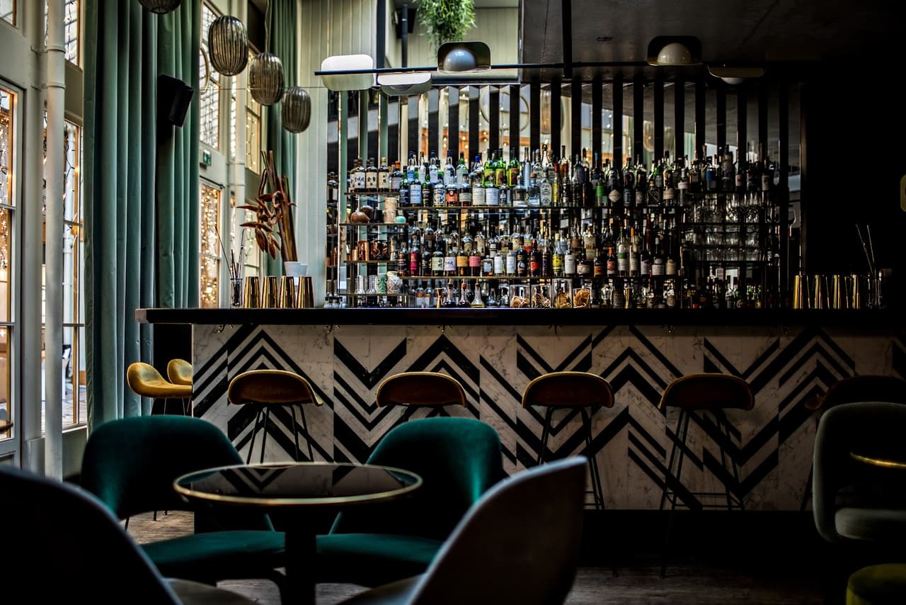 Chic bar interior with geometric design and stocked shelves