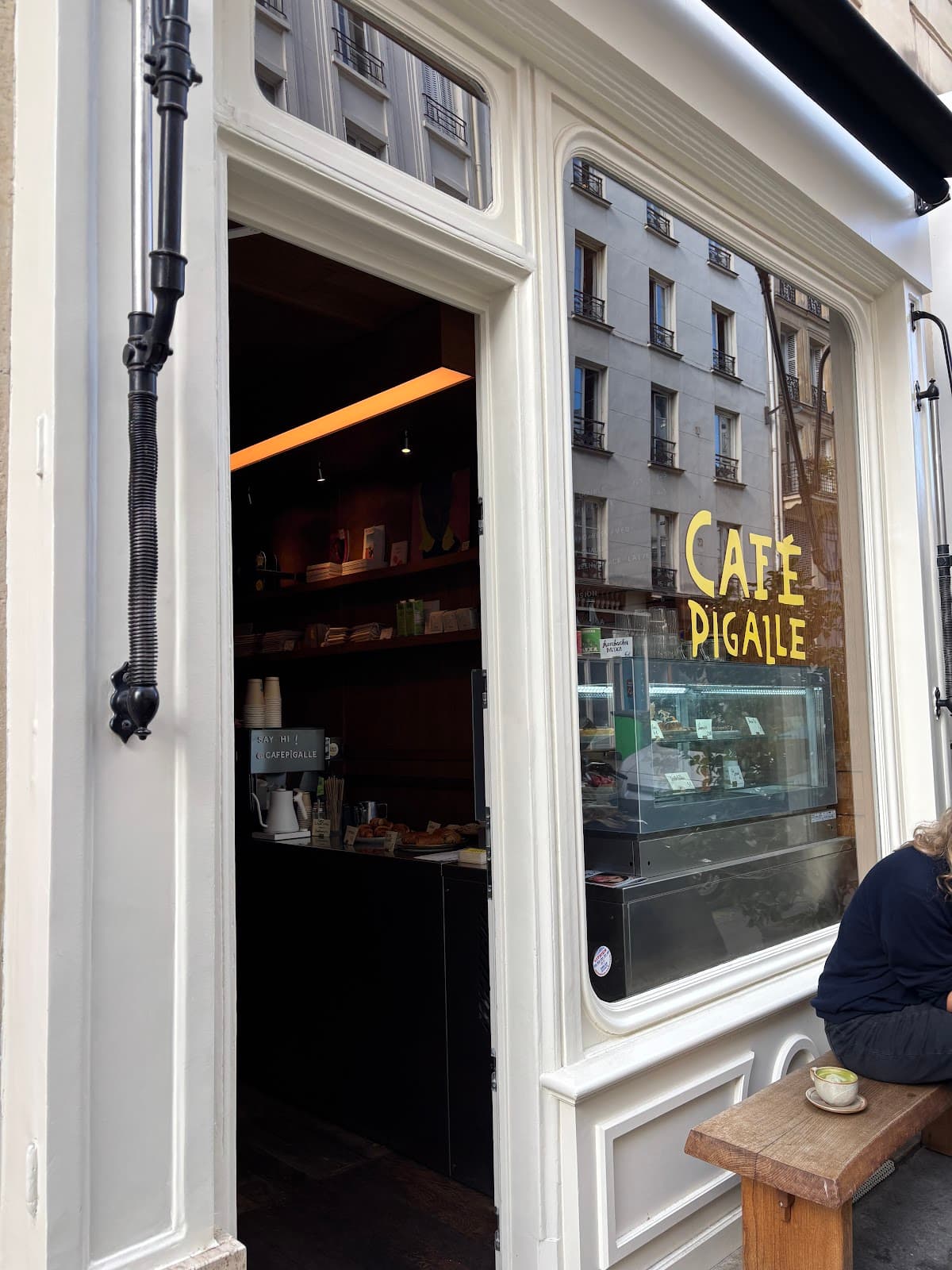 Cafe Pigalle exterior showing entrance and window in Paris