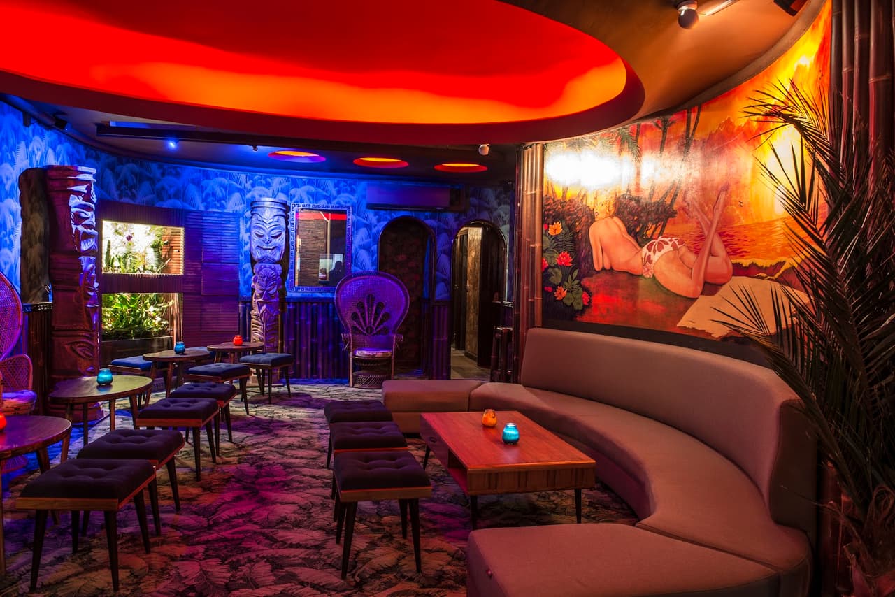 Vibrant interior with colorful lighting and tropical decor
