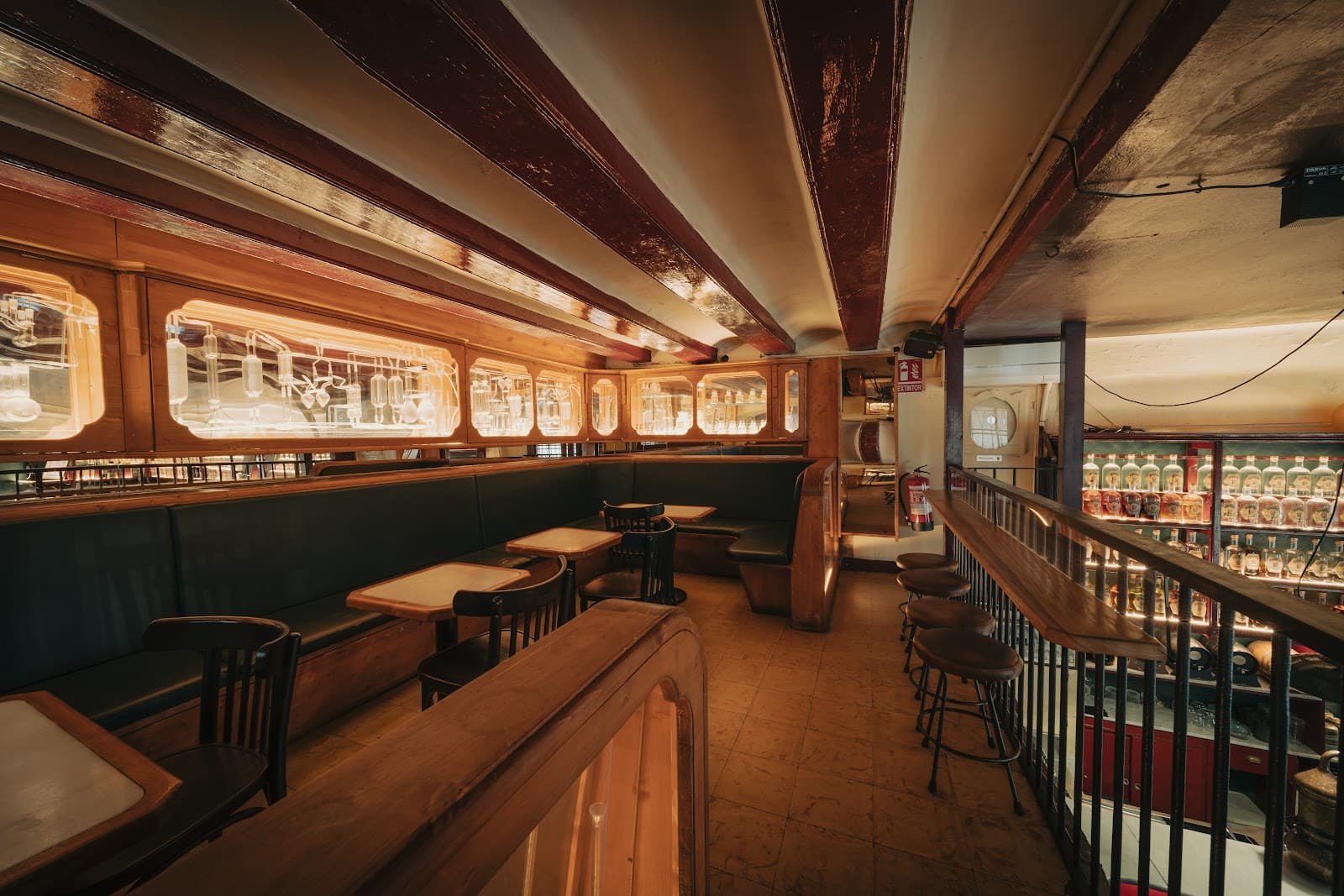 Cozy interior with wooden booths and warm lighting