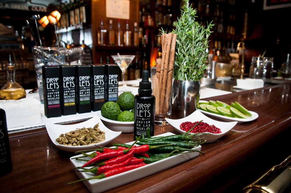 Close-up of bar counter with various cocktail ingredients and bottles in Barcelona