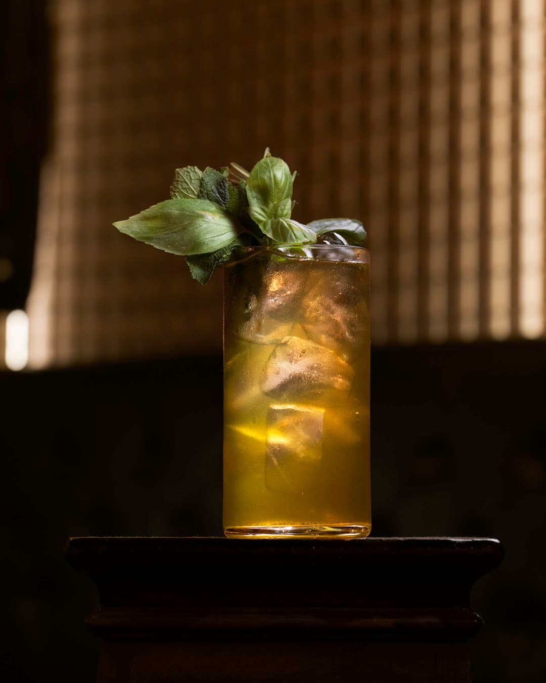 Close-up of a cocktail glass with herbs on a dark background in Barcelona