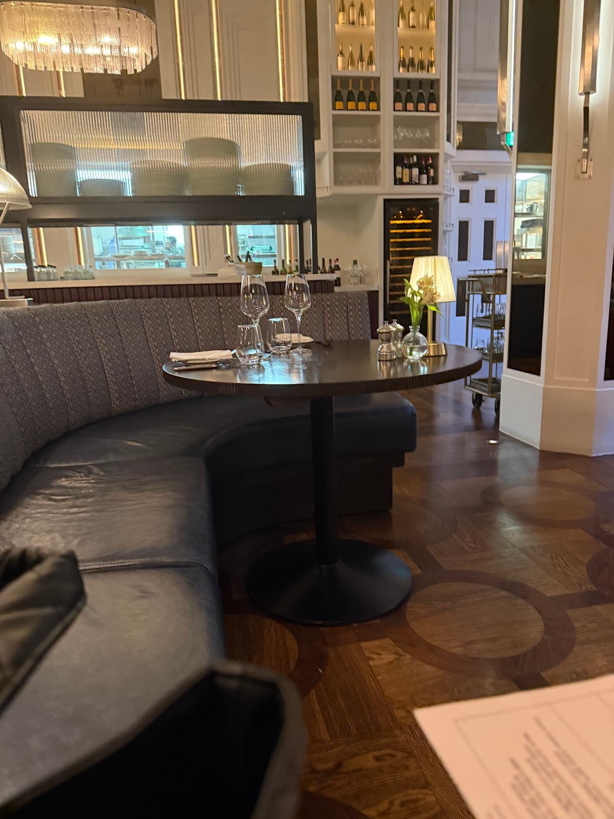 Sophisticated interior with cozy booth seating and elegant lighting in London