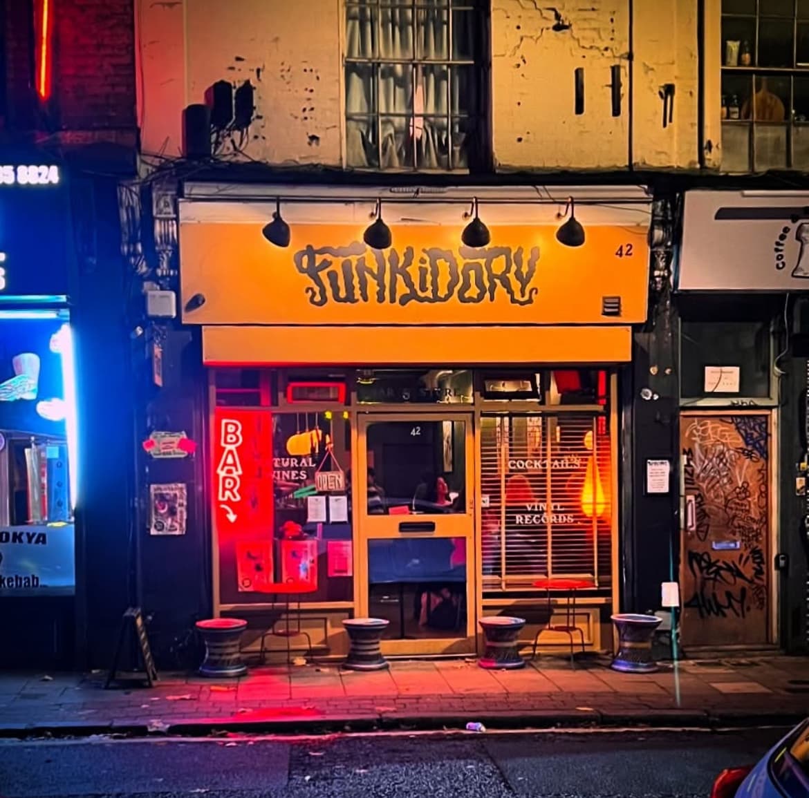 Funkidory bar exterior with colorful signage and neon lights in London