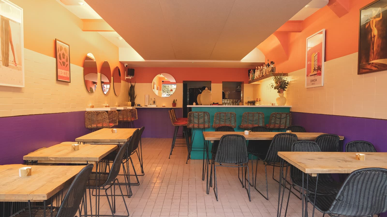 Colorful interior with wooden tables and a bar with vibrant decor