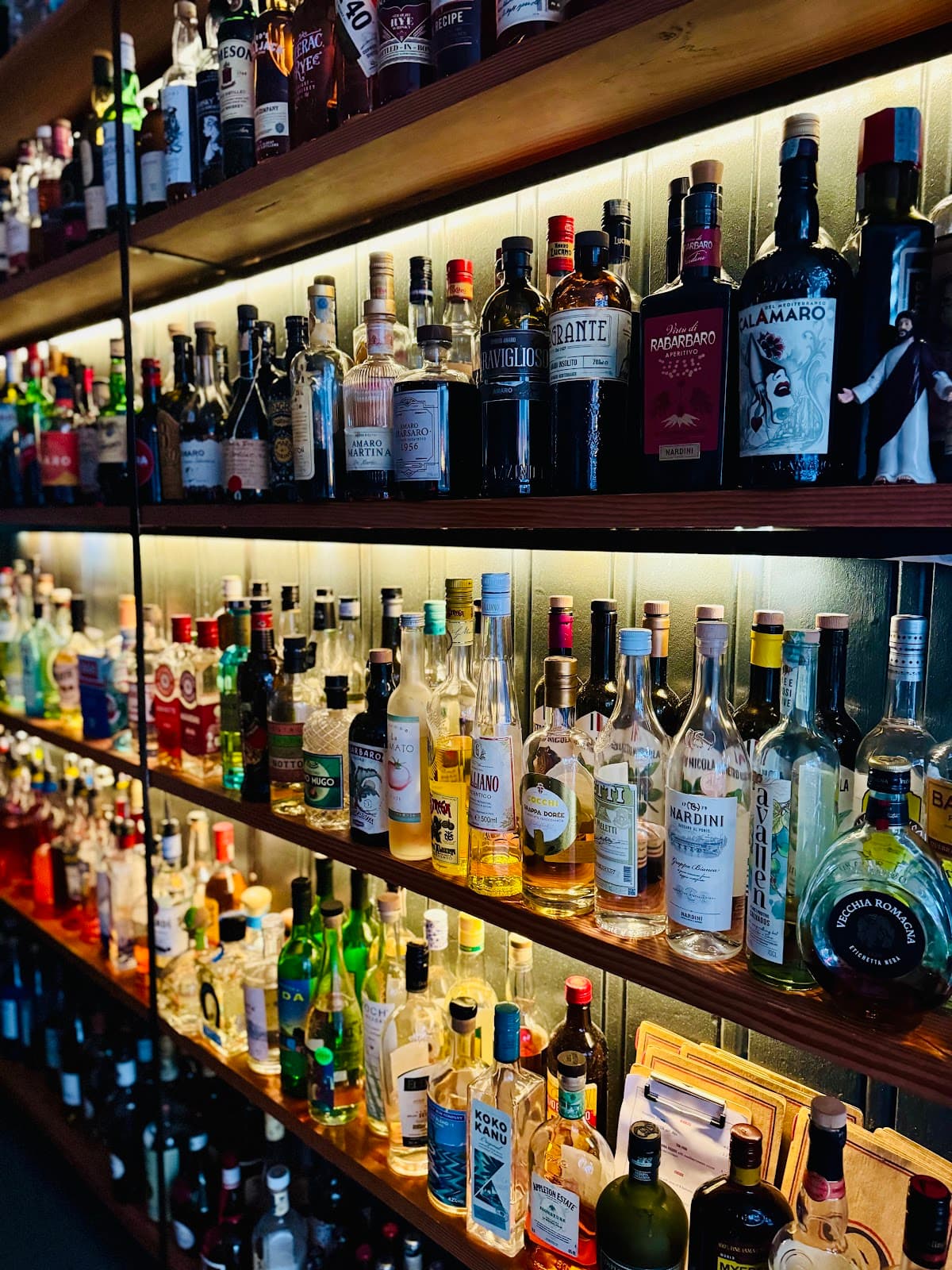 Close-up of well-stocked bar shelves with various bottles in Edinburgh