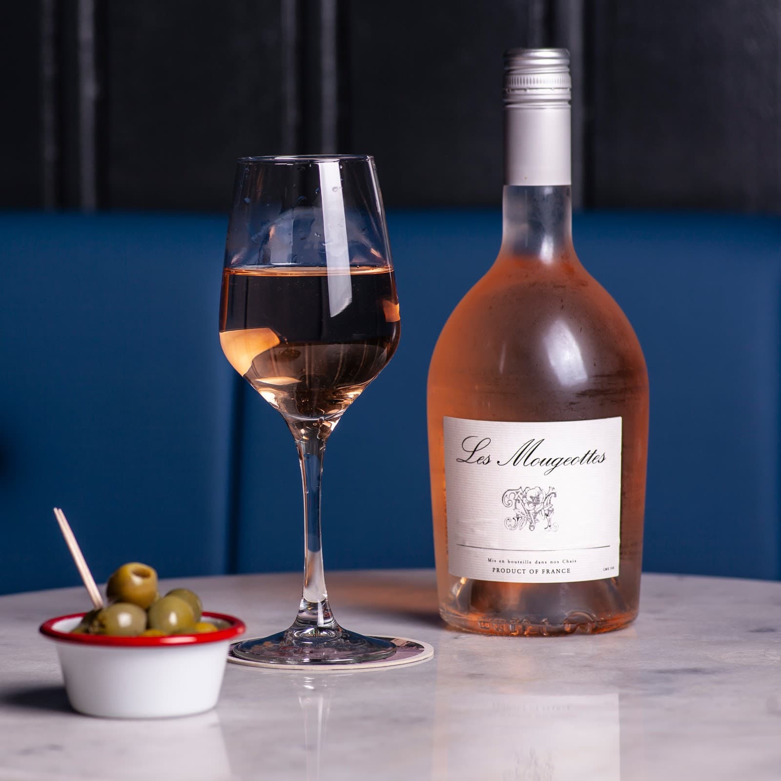 Rosé wine with olives on a marble table in Edinburgh