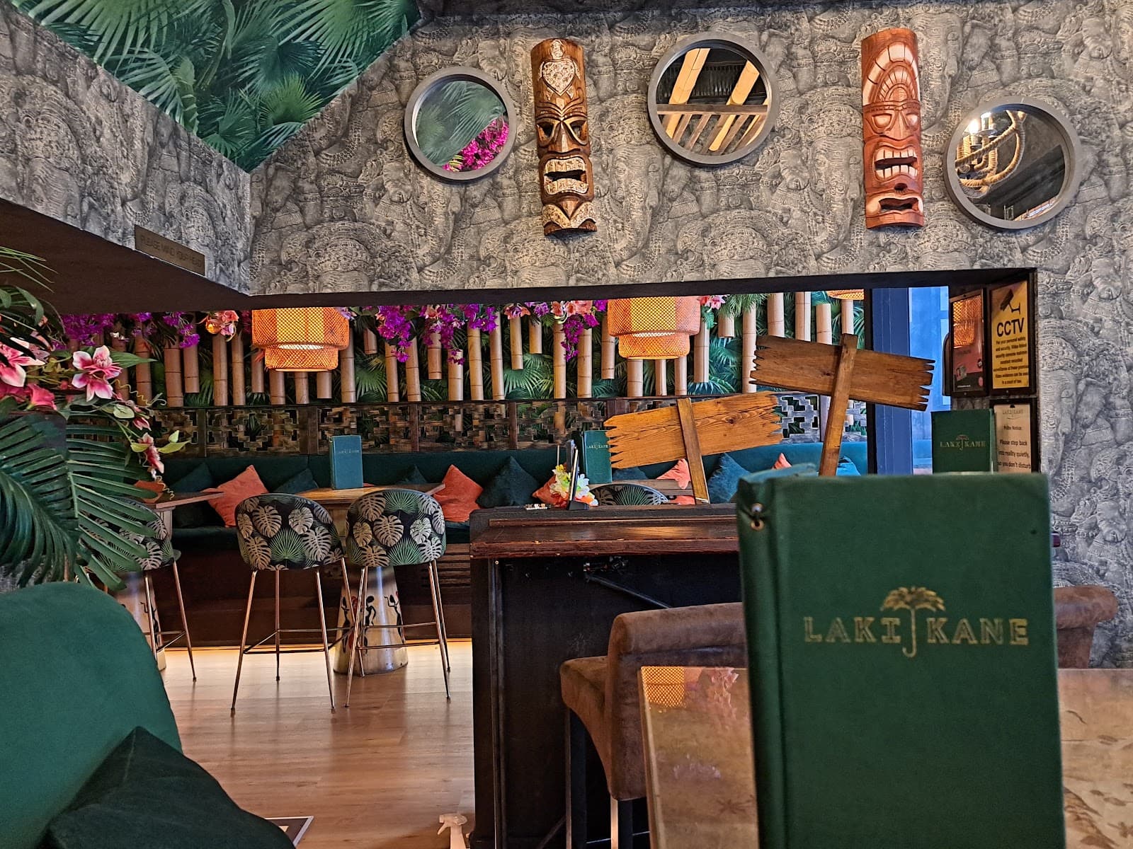 Tropical-themed bar interior with bamboo decor and tiki masks in London