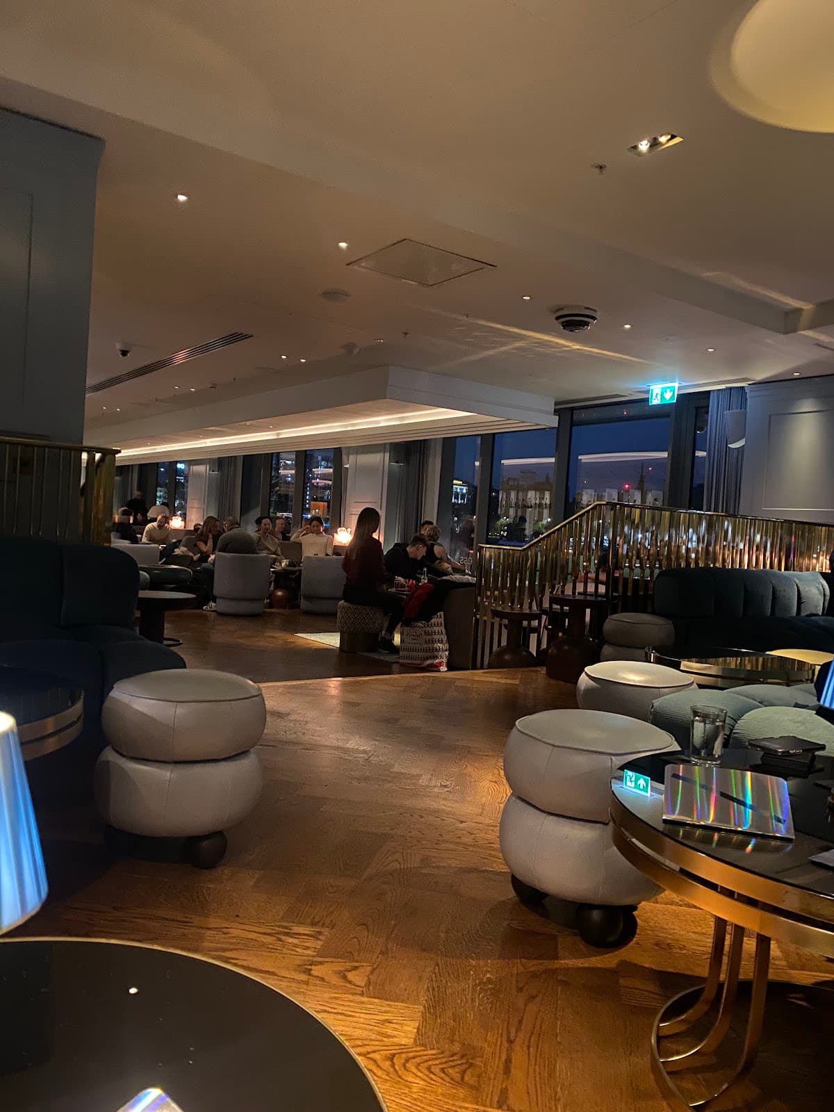 Stylish bar interior with modern seating and soft lighting in London
