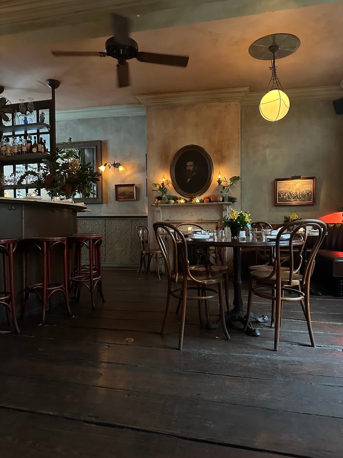 Cozy interior with wooden chairs, tables, and ambient lighting in New York