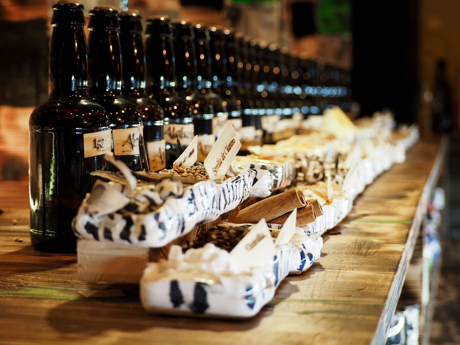 Close-up of a bar counter with bottles and snacks in Barcelona
