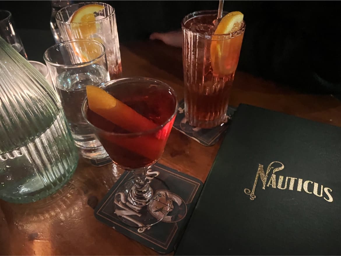 Close-up of cocktails on a wooden table at Nauticus in Edinburgh
