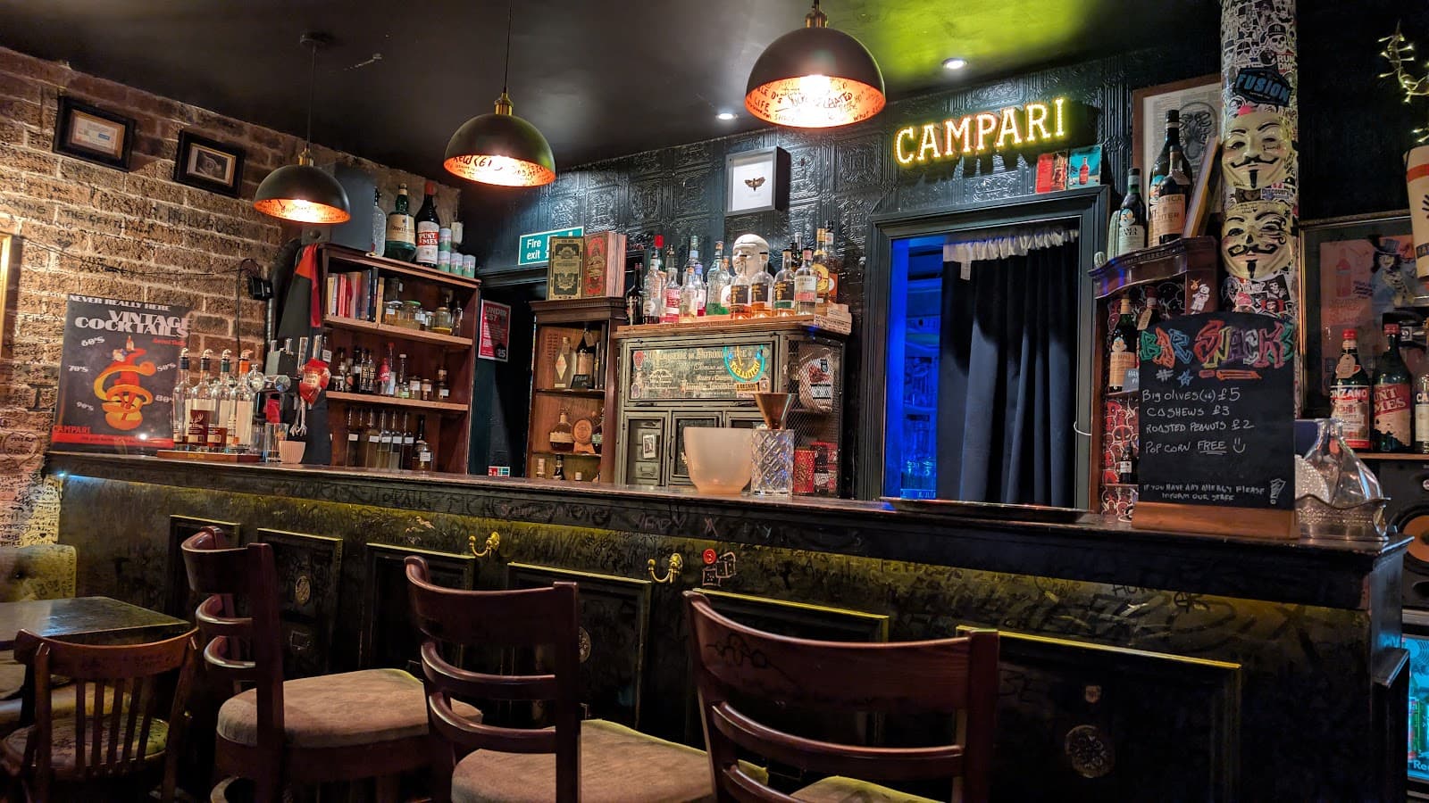 Cozy bar interior with vintage decor and Campari sign