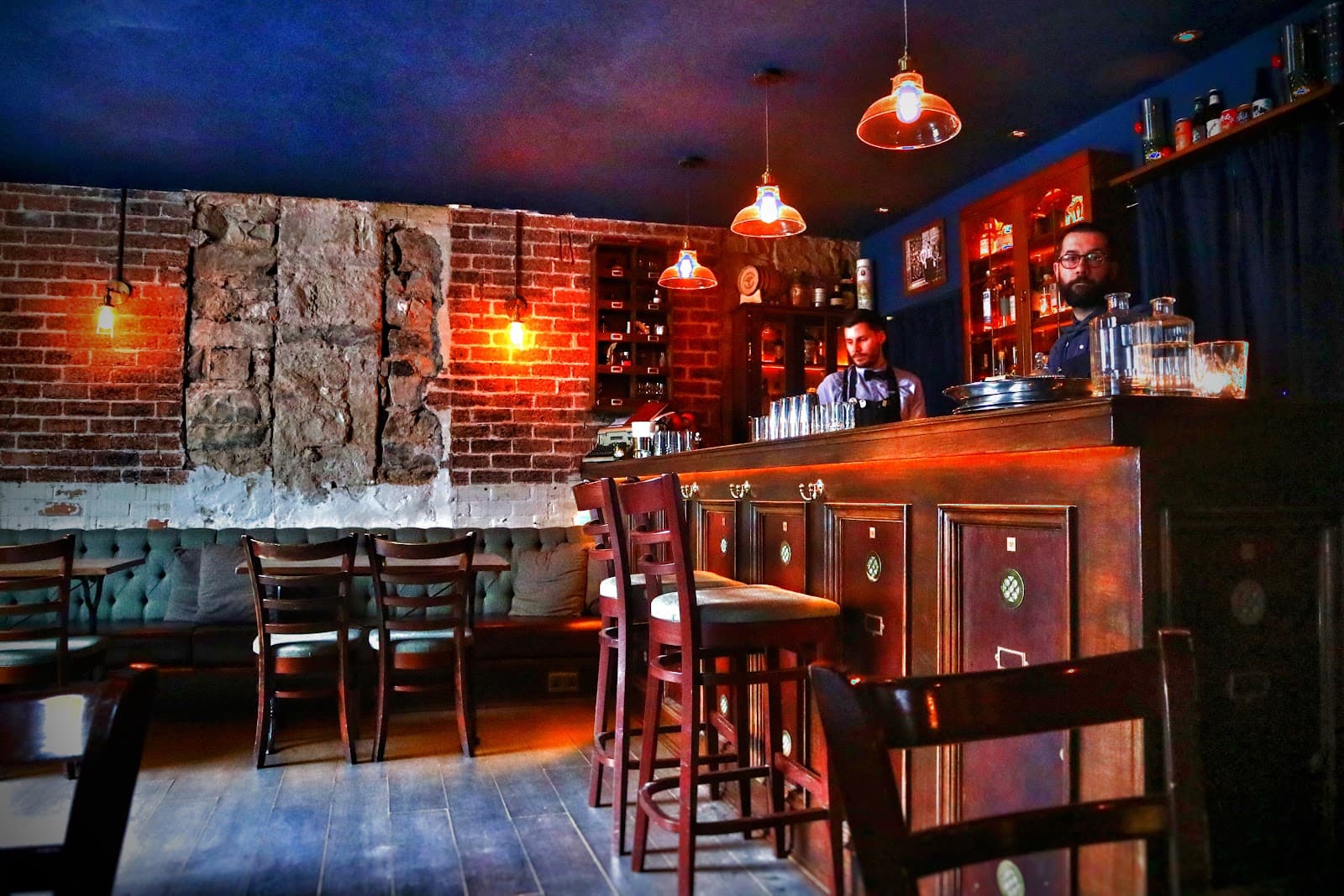 Cozy bar interior with exposed brick and warm lighting in Edinburgh