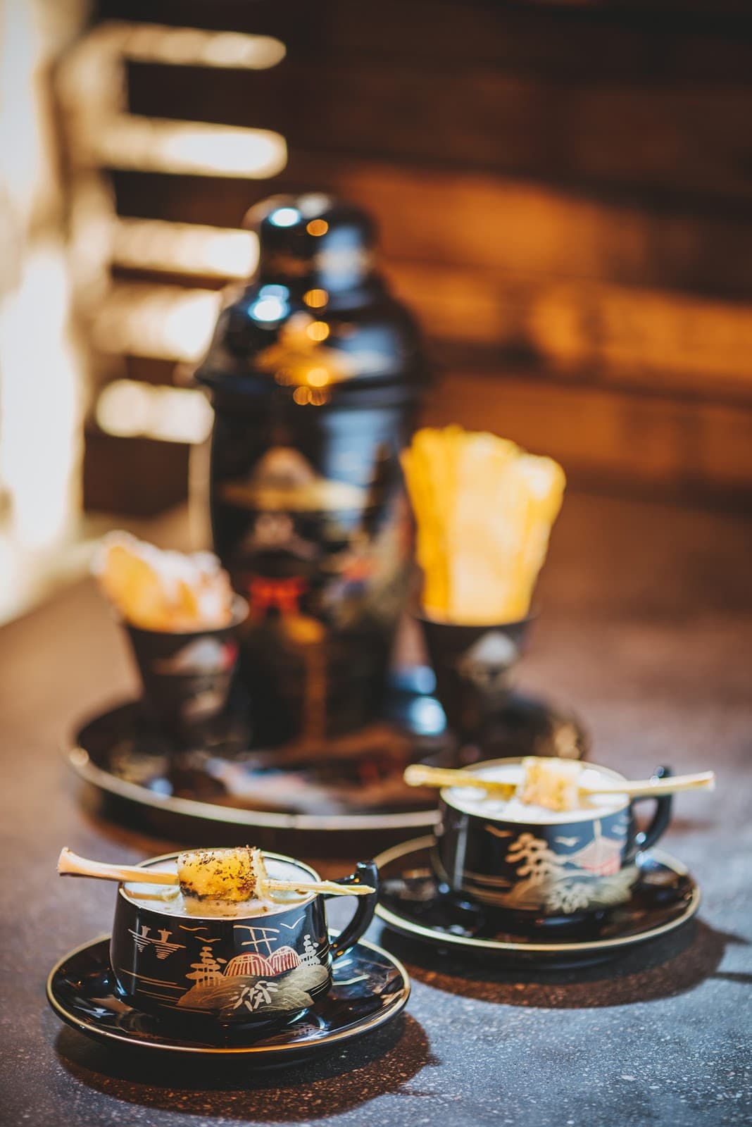 Stylish cocktail served in ornate cups with a Japanese theme in Edinburgh