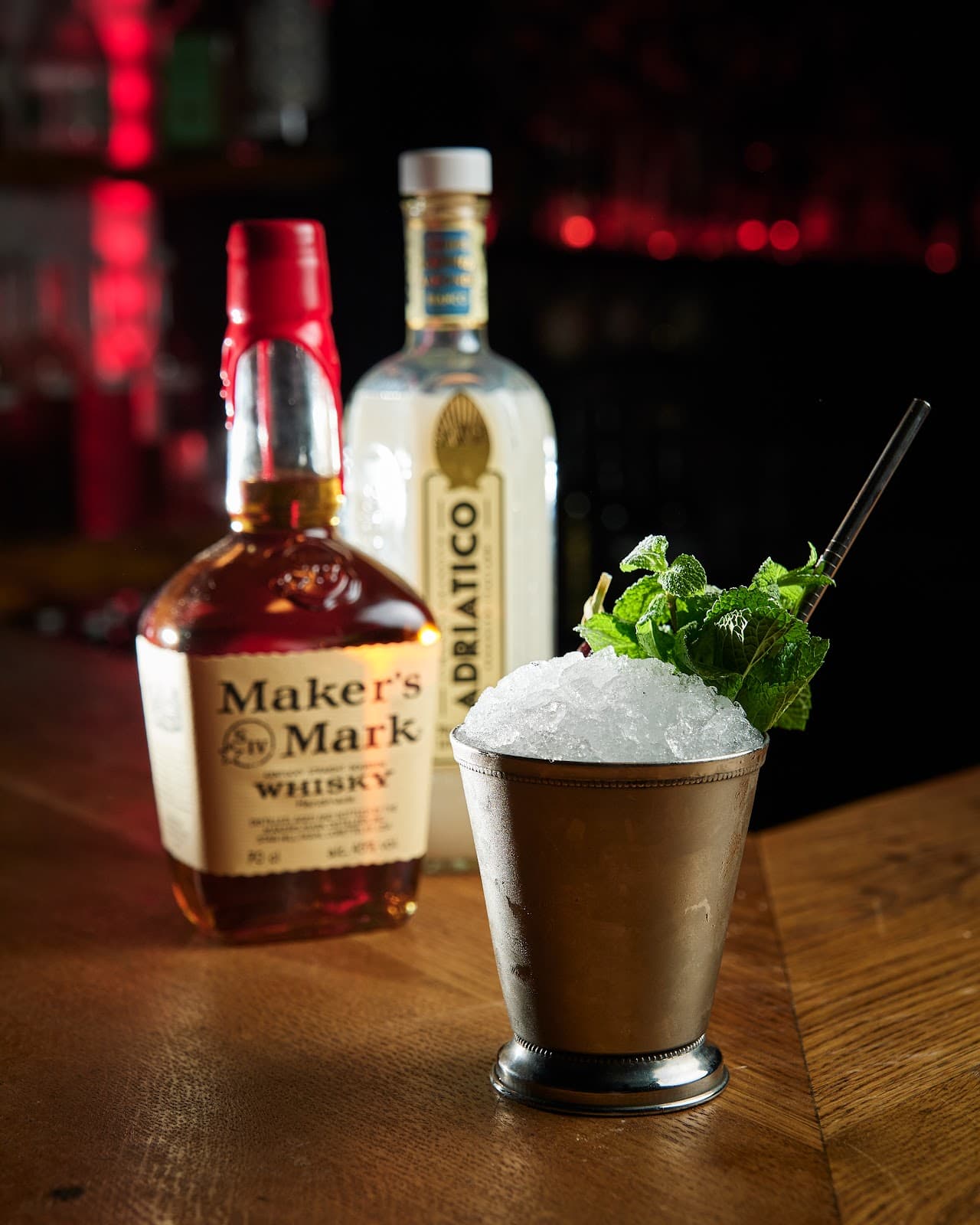 Cocktail on bar with Maker's Mark and Adriatico bottles in background in Edinburgh