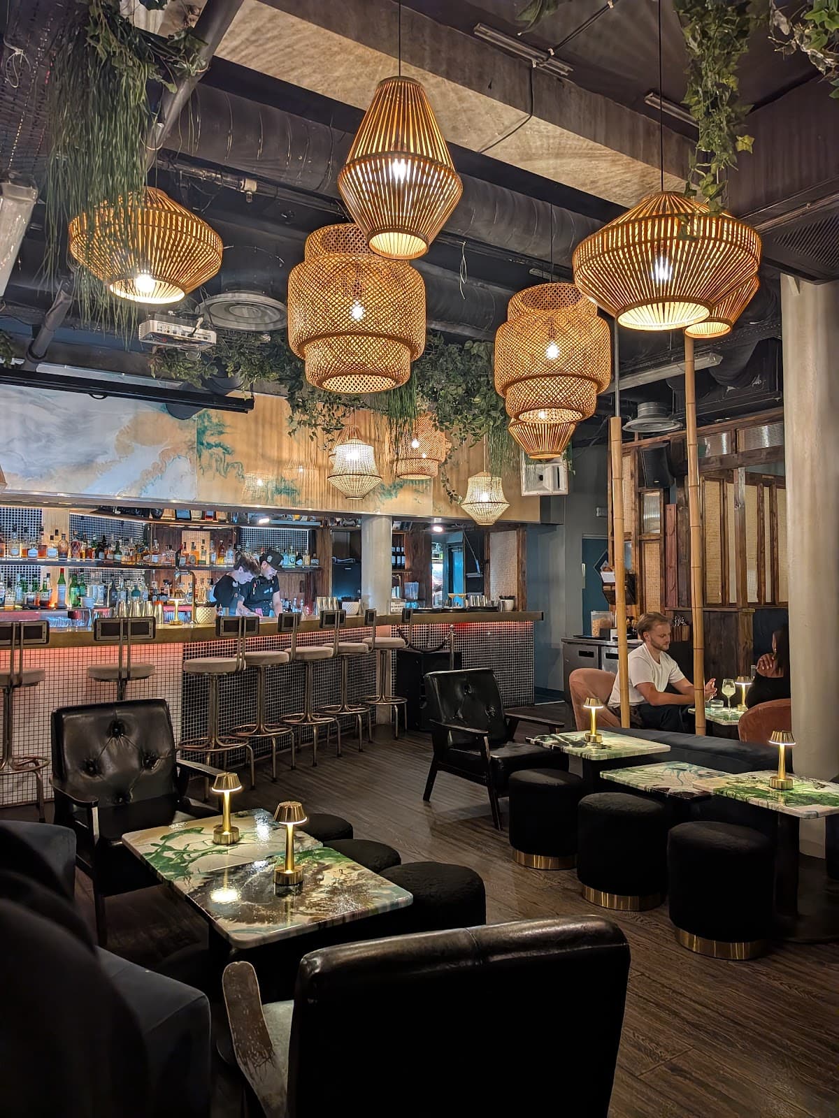 Cozy bar interior with elegant lighting and seating in London