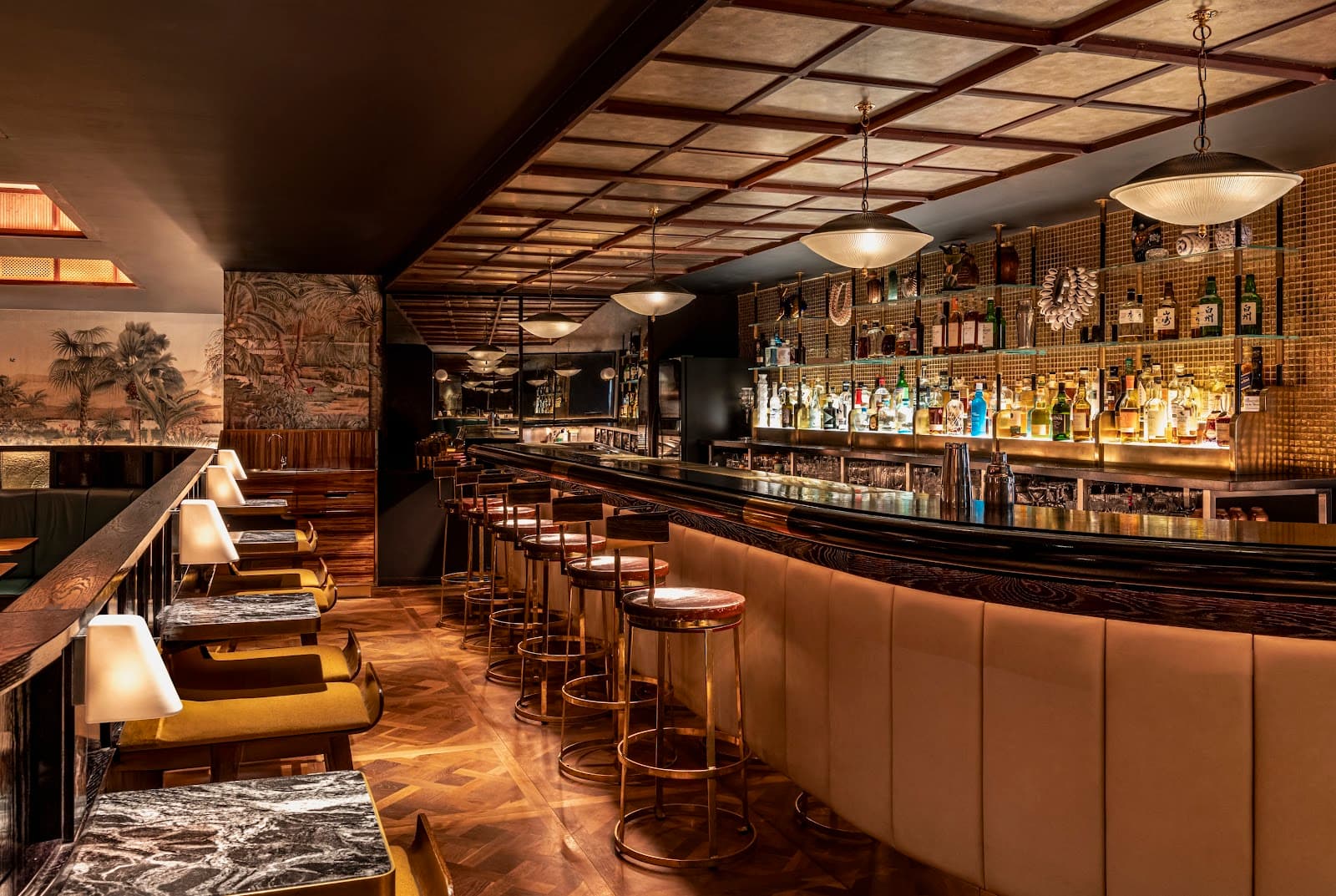 Elegant bar interior with plush seating and a well-stocked liquor display. in London