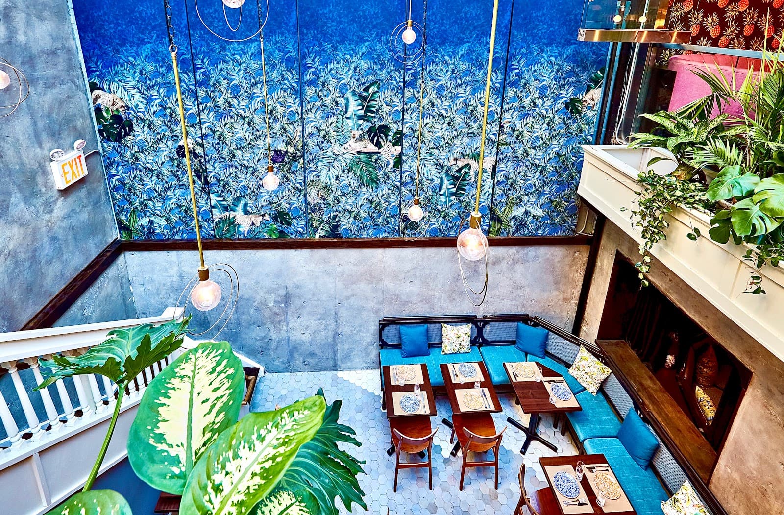 Spacious interior with vibrant blue mural and modern seating area in New York